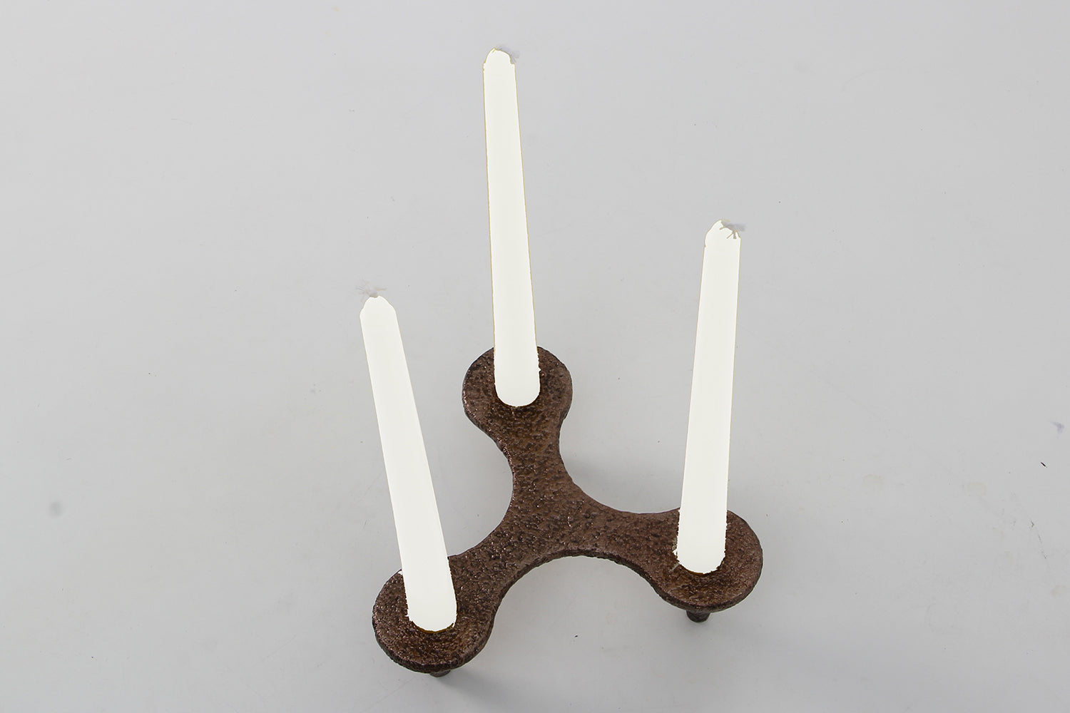 Bronze Candle stick designed by Henry Forwood