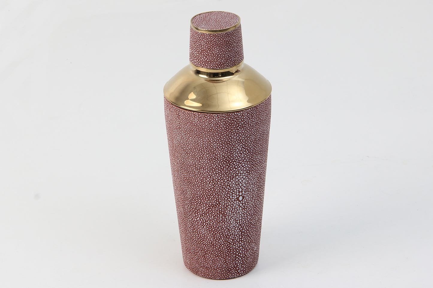 Luxury barware shaker in coral texture on marble counter