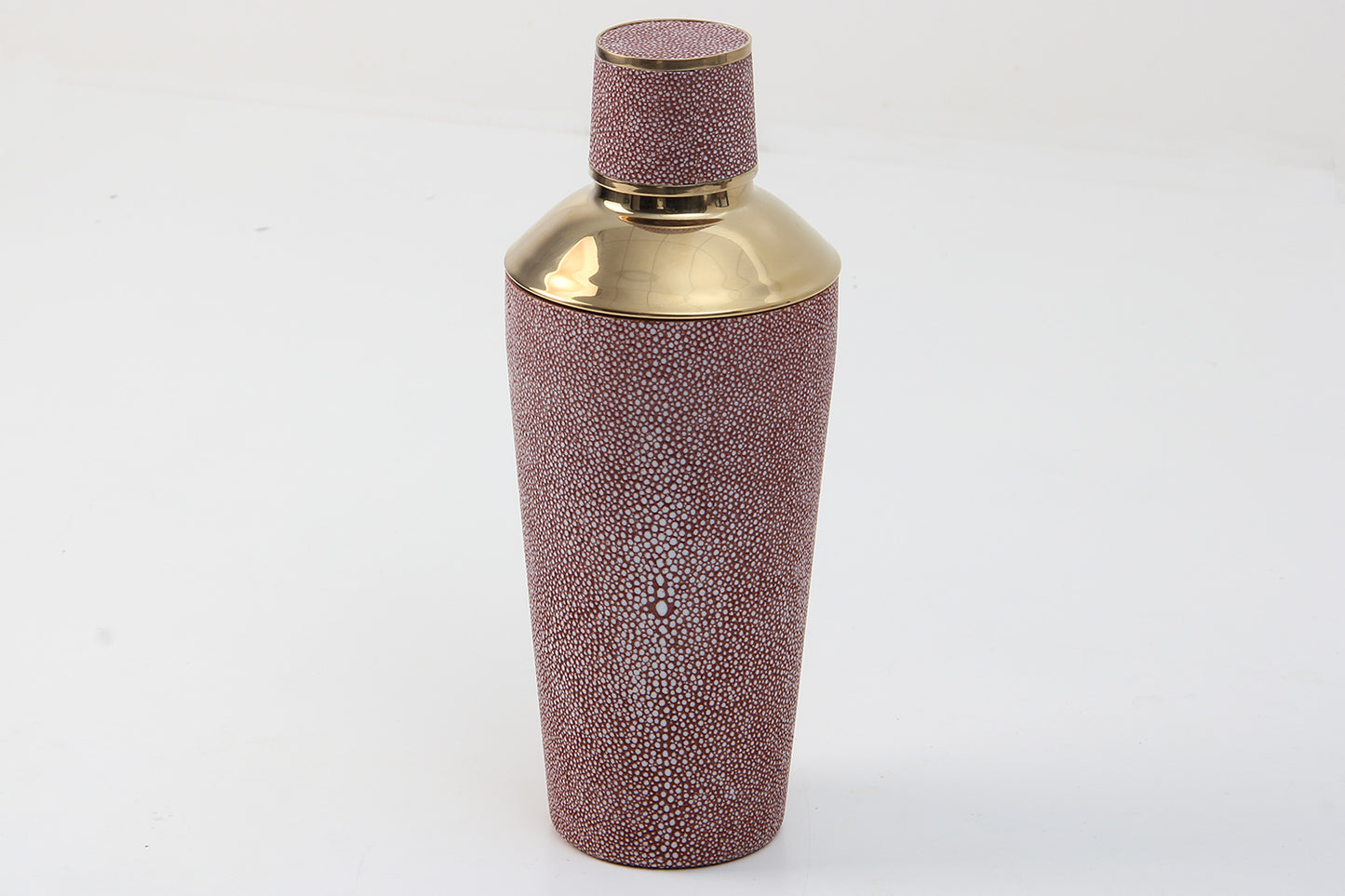 Coral cocktail shaker styled in home bar setup
