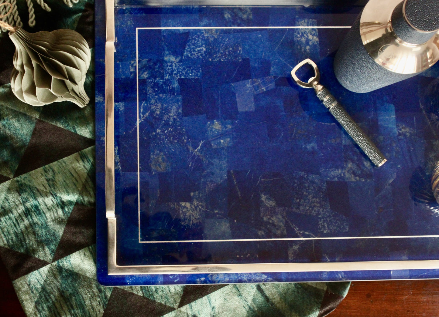 A luxurious blue Lapis Lazuli drinks tray with a stainless steel edge and handles