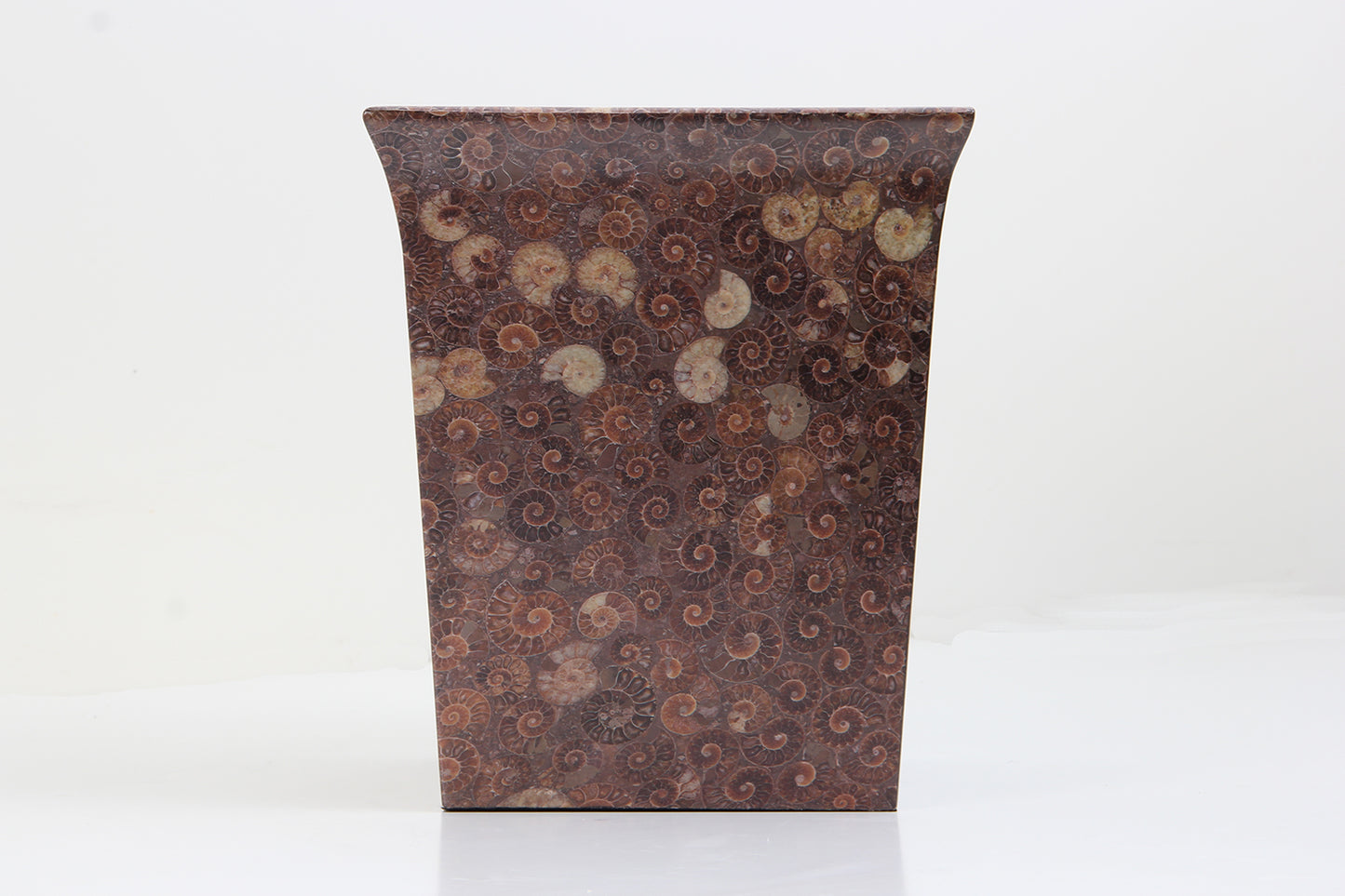 Unique waste paper bin in an ammonite finish