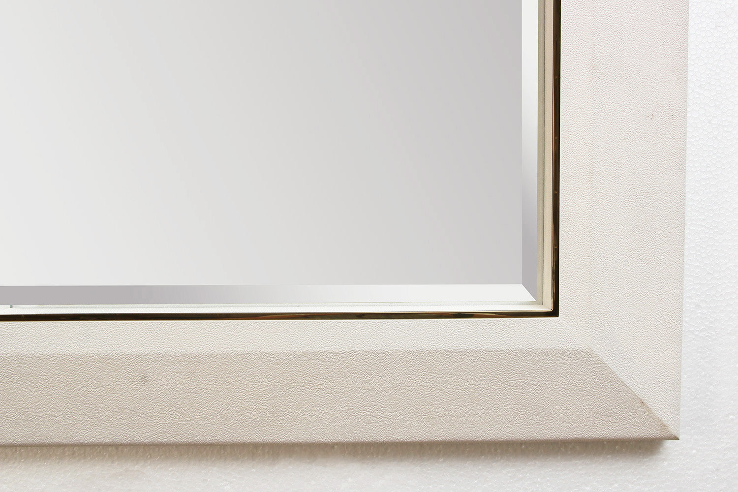 Detail of white faux shagreen mirror frame
