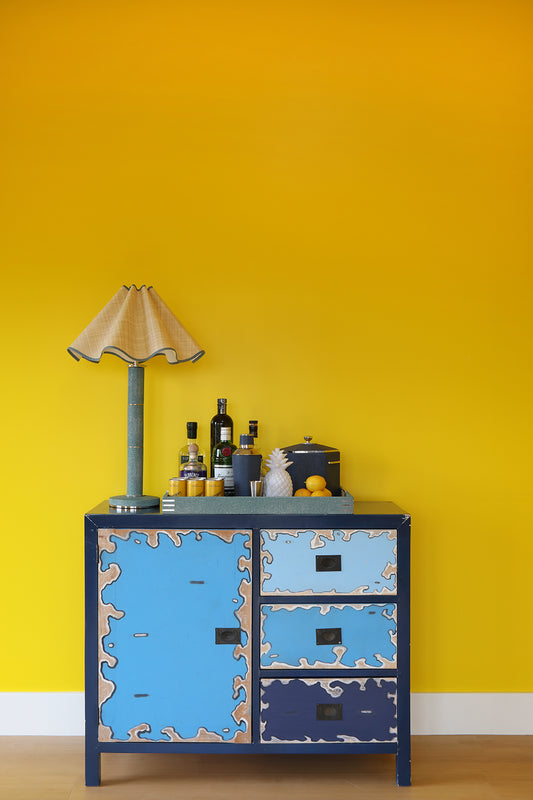 A teal shagreen column table lamp with a silk light cream shade.