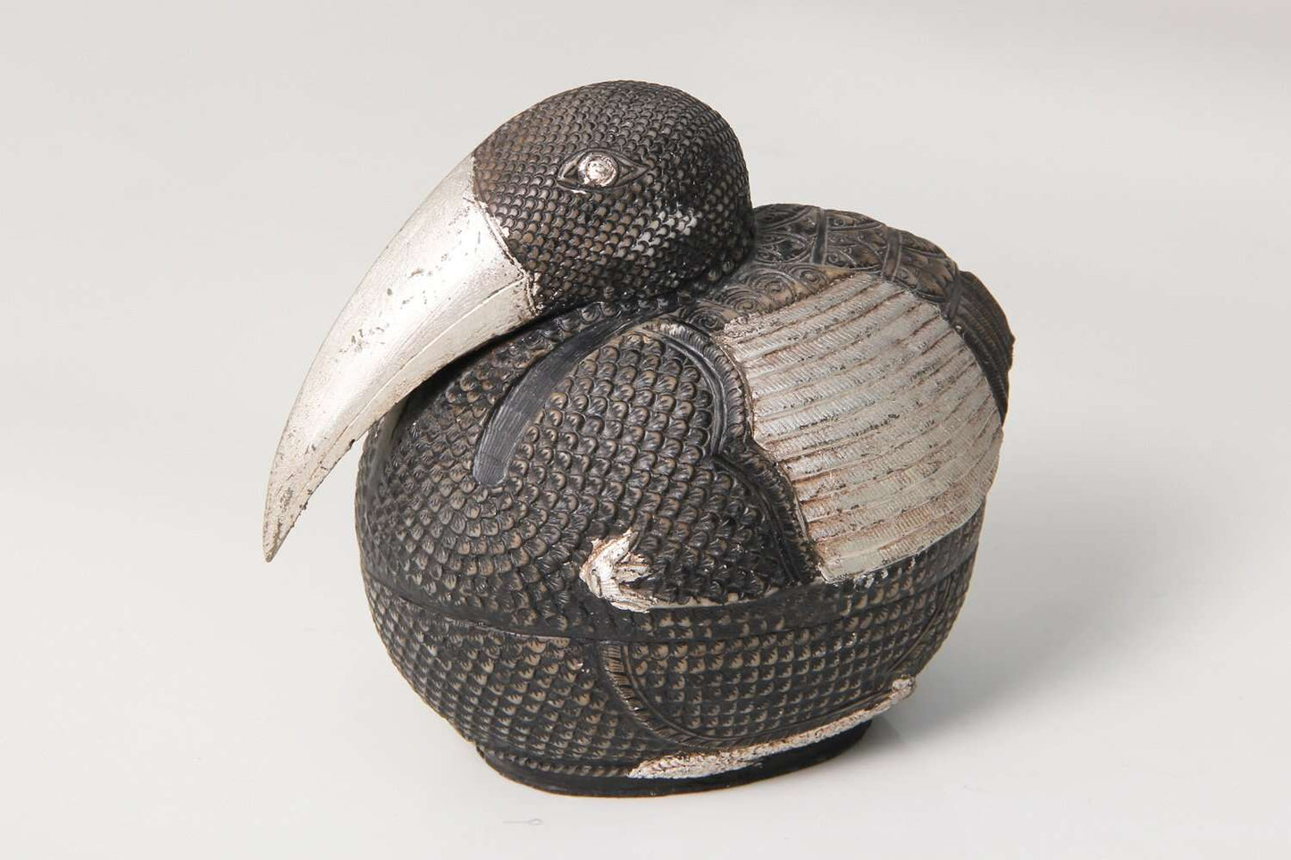 Silver sculpture interior Cambodian pelican bird sculpture