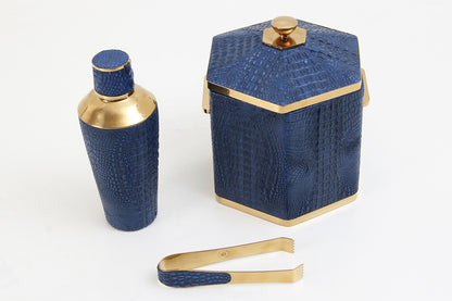 Blue crocodile cocktail shaker displayed with matching luxury ice bucket and brass ice tongs by Henry Forwood