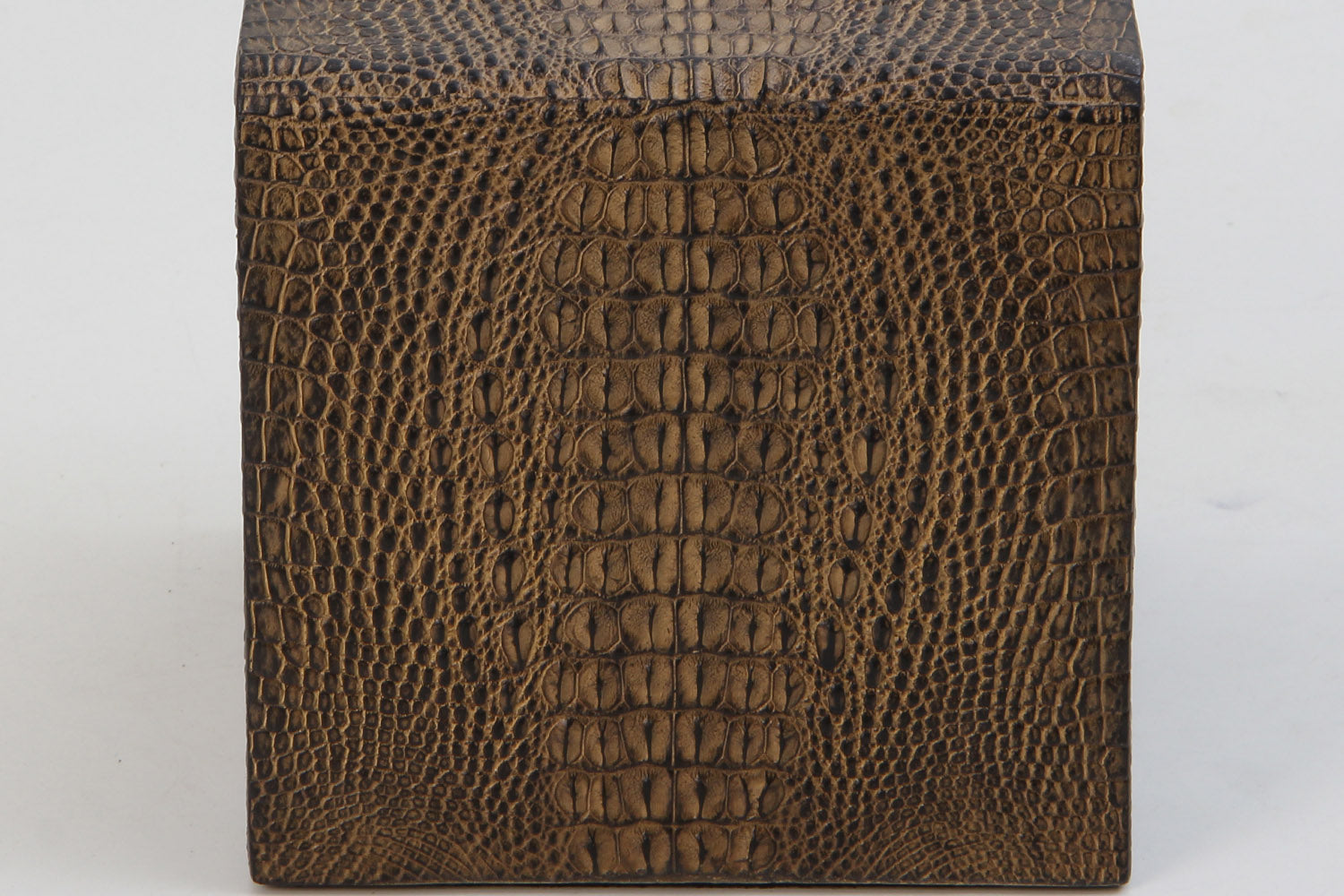 Close-up of hand-crafted square tissue box holder featuring detailed crocodile finish.