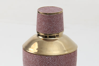 Close-up of coral shagreen texture and shaker lid