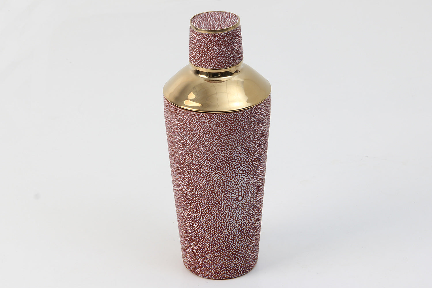 Luxury barware shaker in coral texture on marble counter