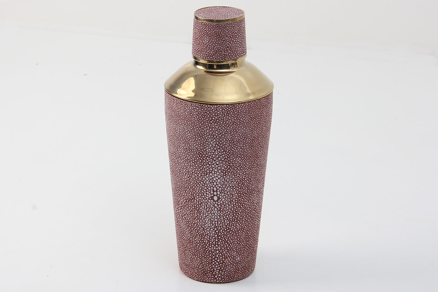 Coral cocktail shaker styled in home bar setup