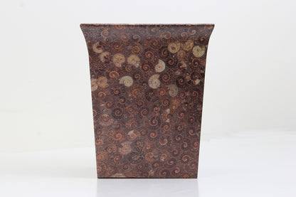 Unique waste paper bin in an ammonite finish