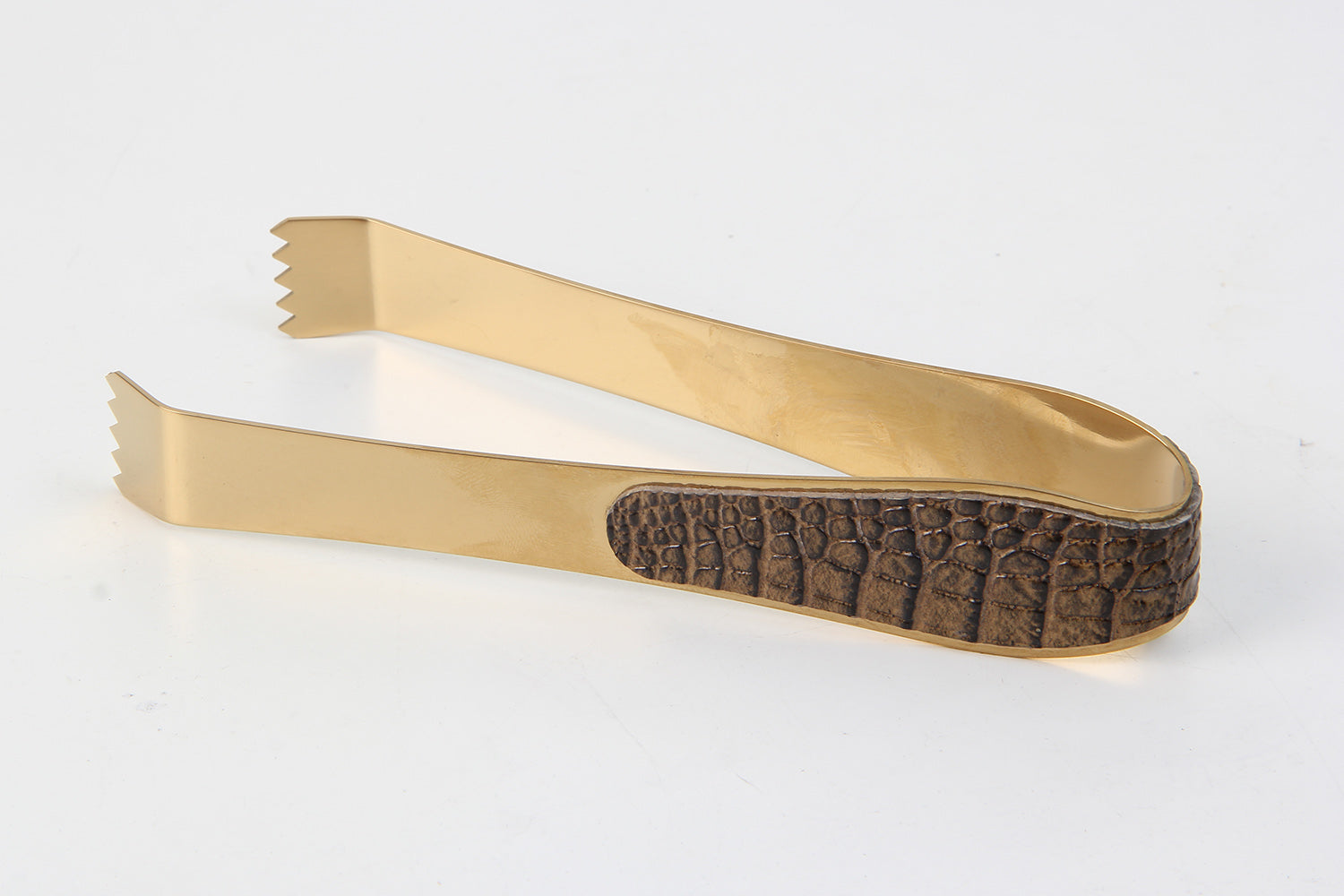 Close-up of Crocodile & Brass Designer Ice Tongs – Elegant Grip