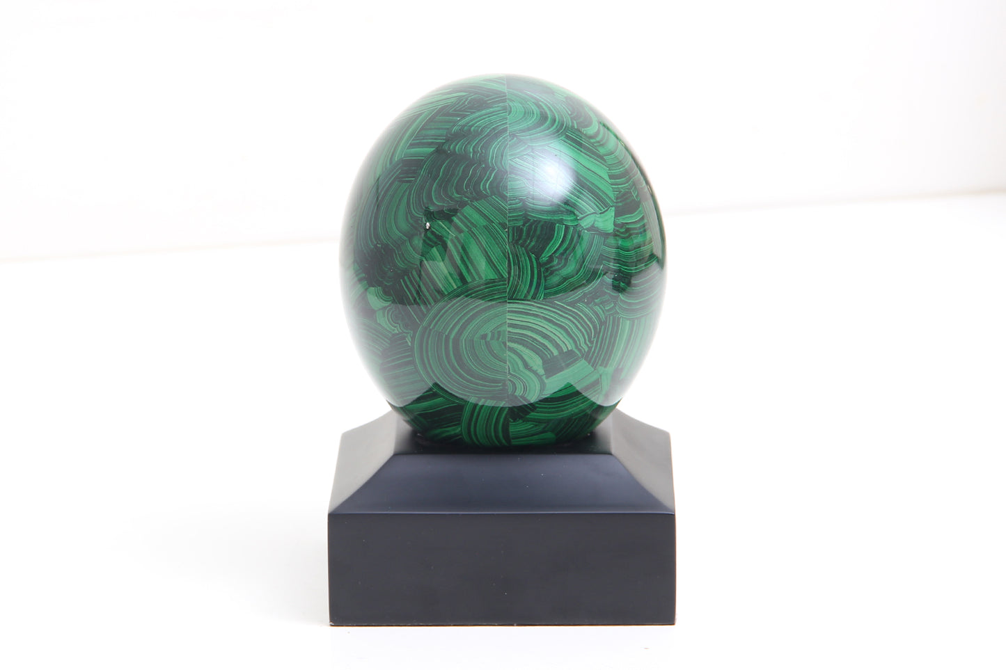 Green malichite egg on a black stand by Forwood Design