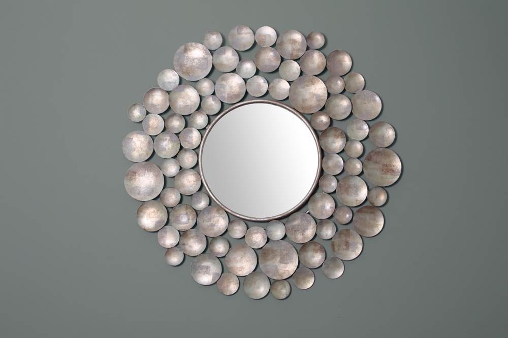 A unique round mirror by Henry Forwood