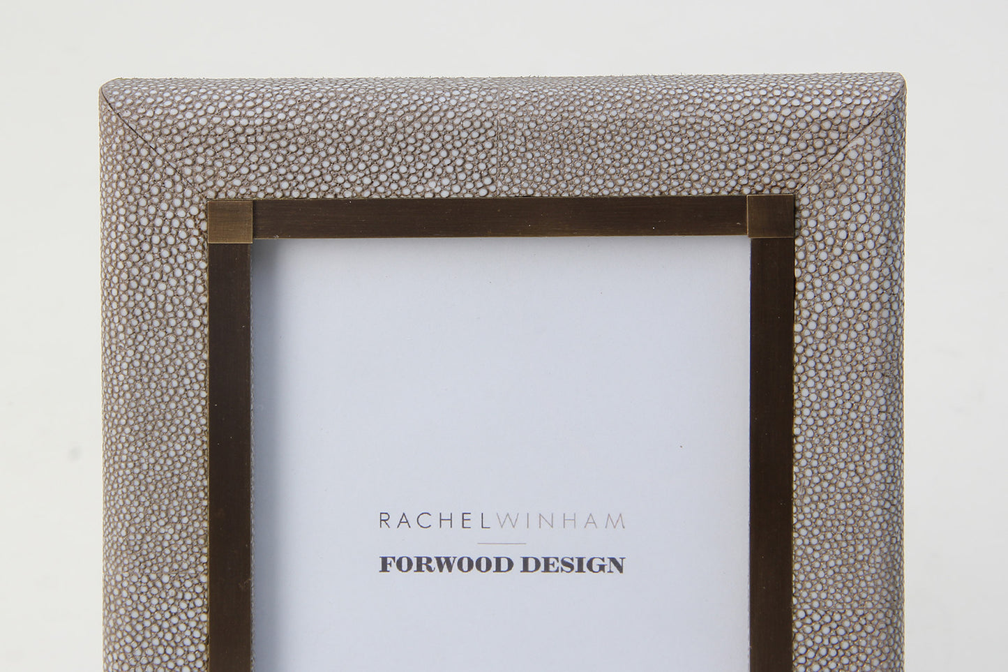 Close-up of dune shagreen photo frame with elegant antique brass inlay