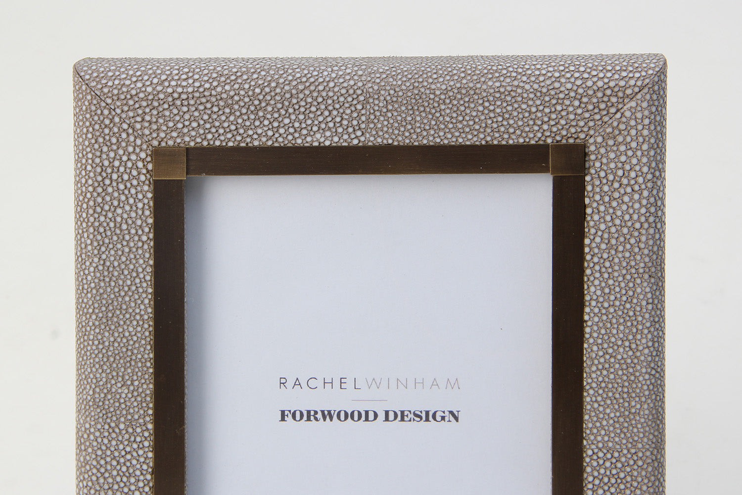 Close-up of dune shagreen photo frame with elegant antique brass inlay