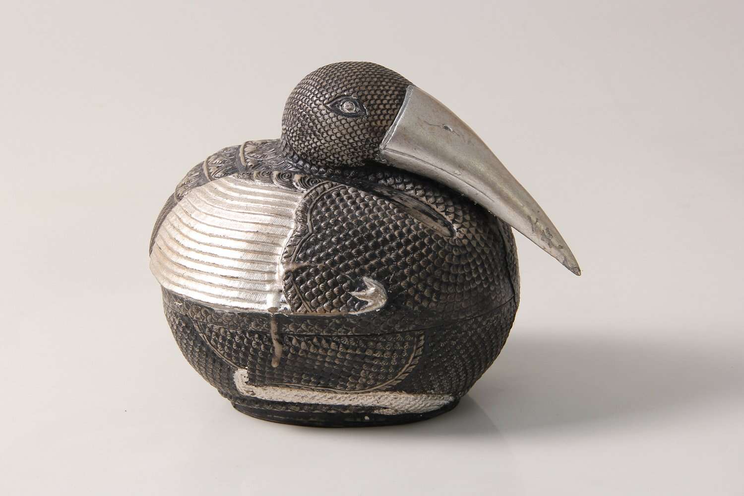 small silver bird sculpture interior design sculpture