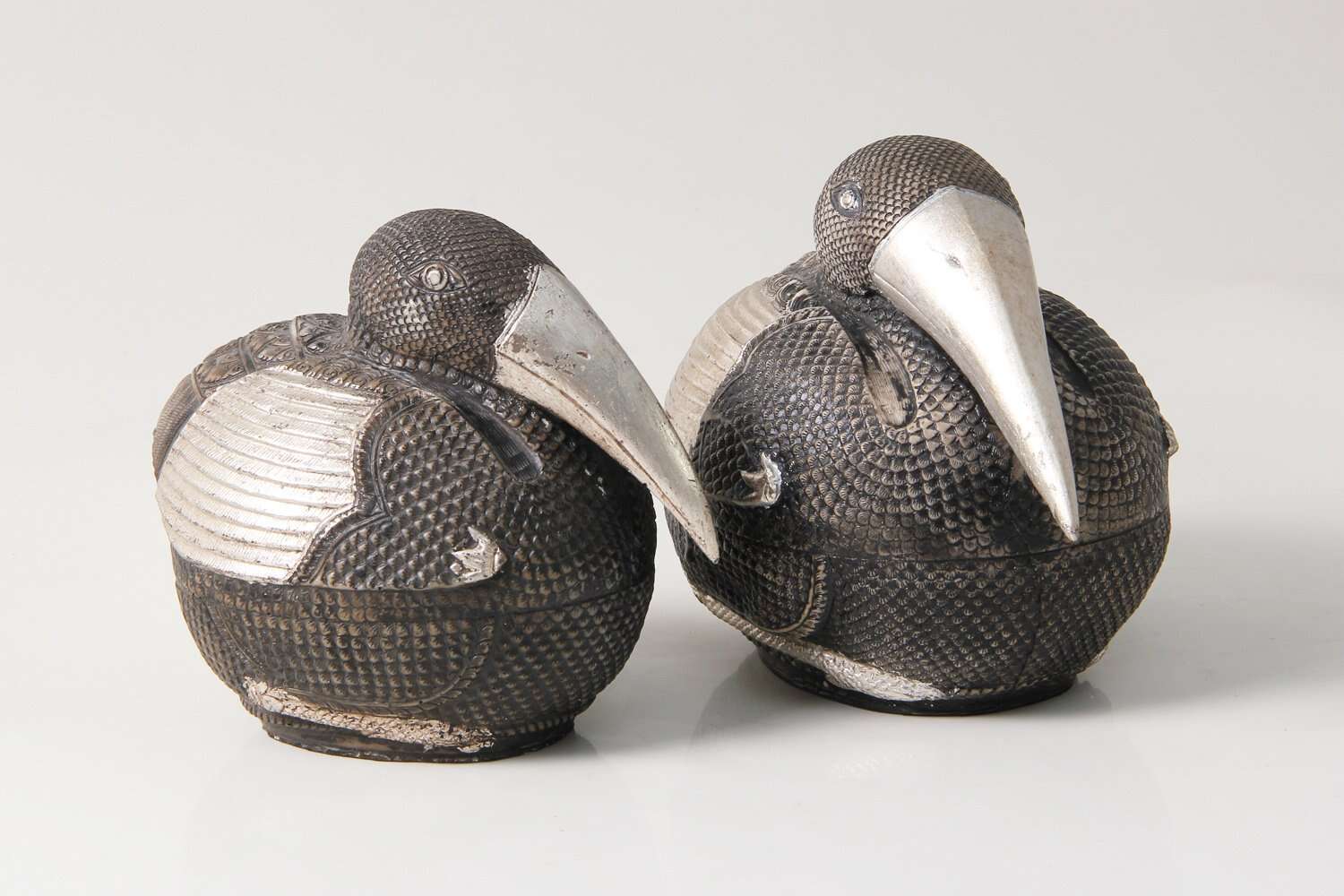 Pair of silver bird sculptures for interior decorators