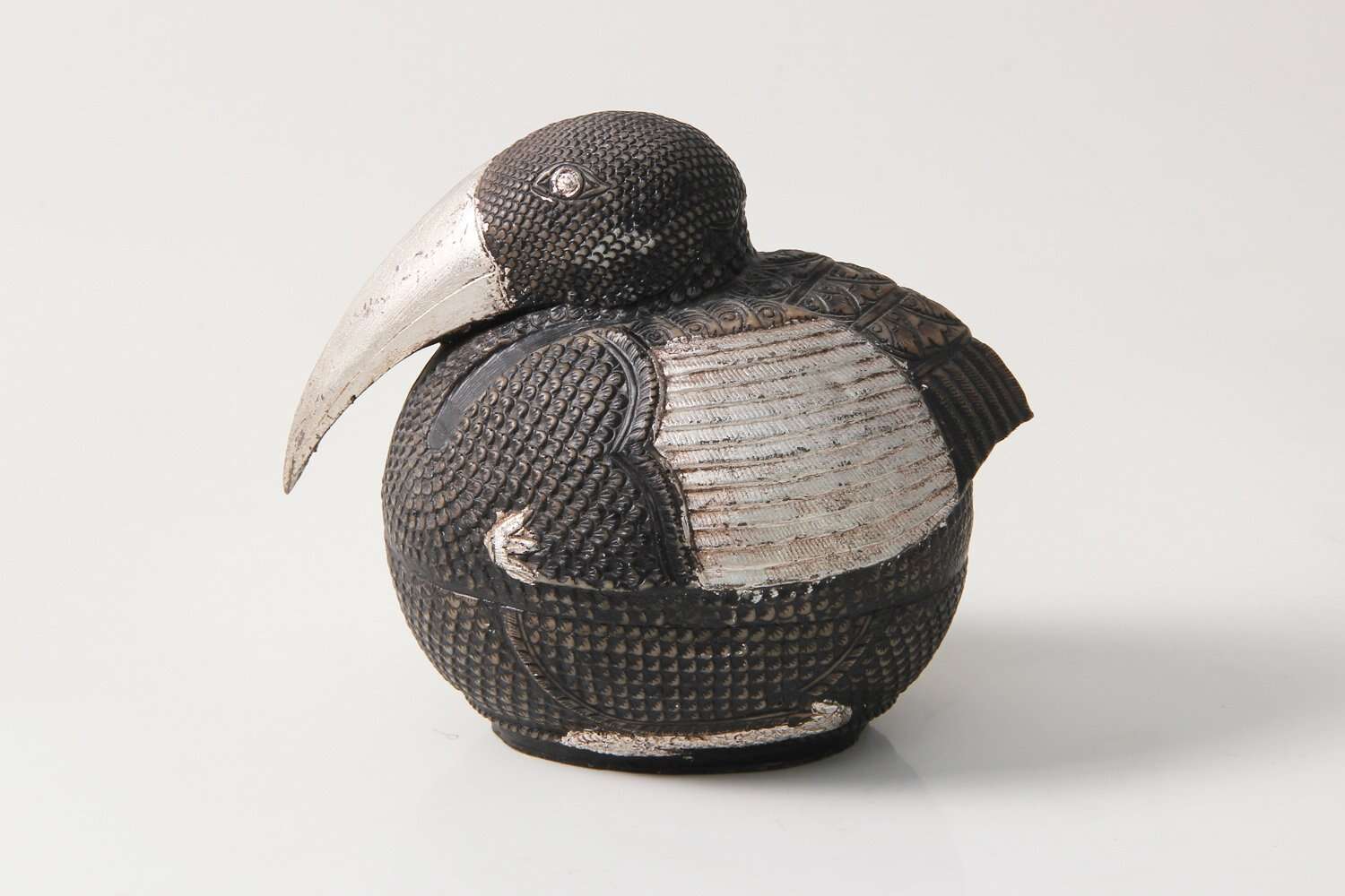 sculpture of a silver pelican bird gift present